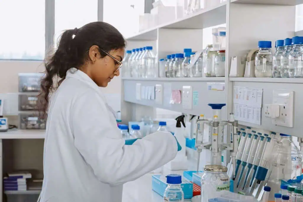Woman in lab coat working in lab